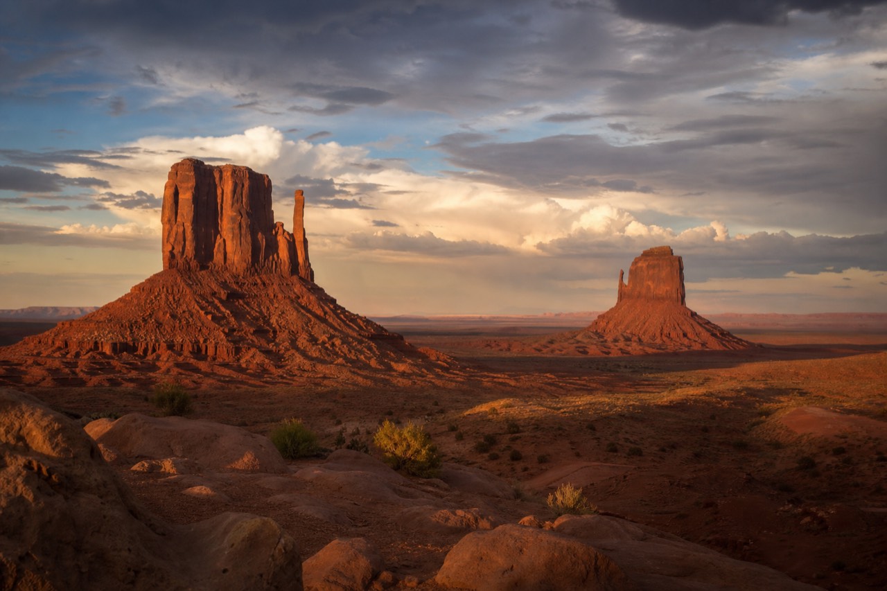 The Mitten Buttes of Monument Valley under warm golden light