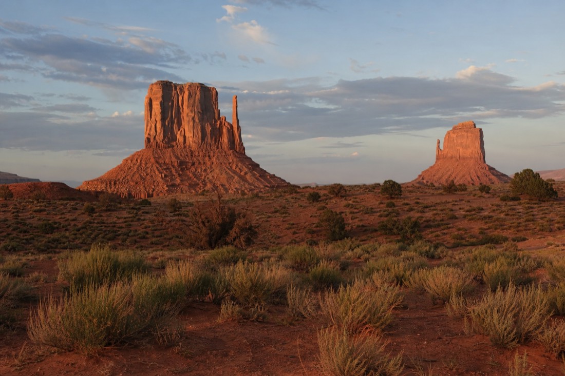 West and East Mitten Buttes glowing under late afternoon sun from the Valley Drive