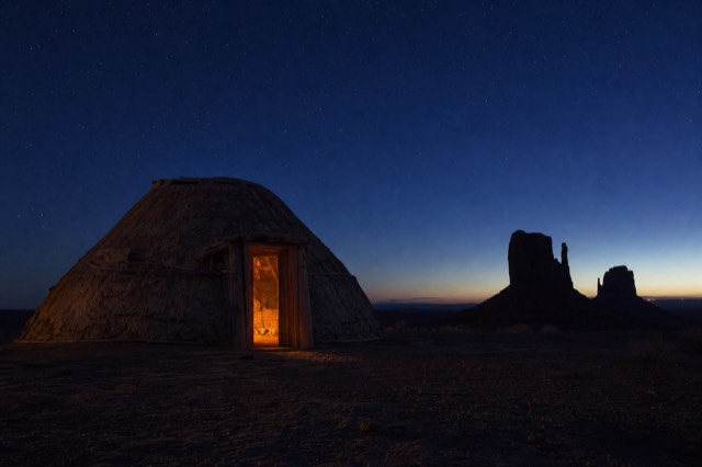 Traditional Navajo hogan in the Monument Valley backcountry under a night sky